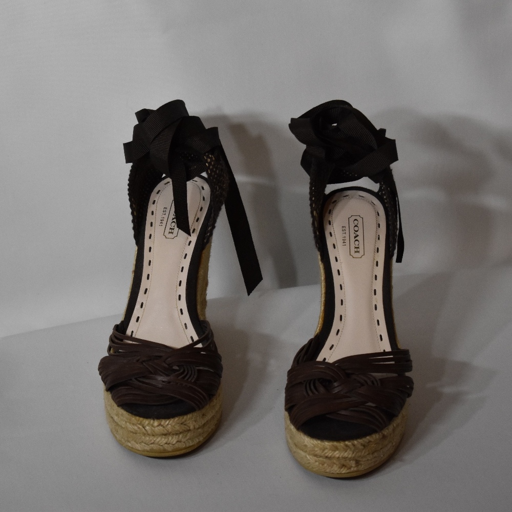 Brown leather Coach wedge sandals.